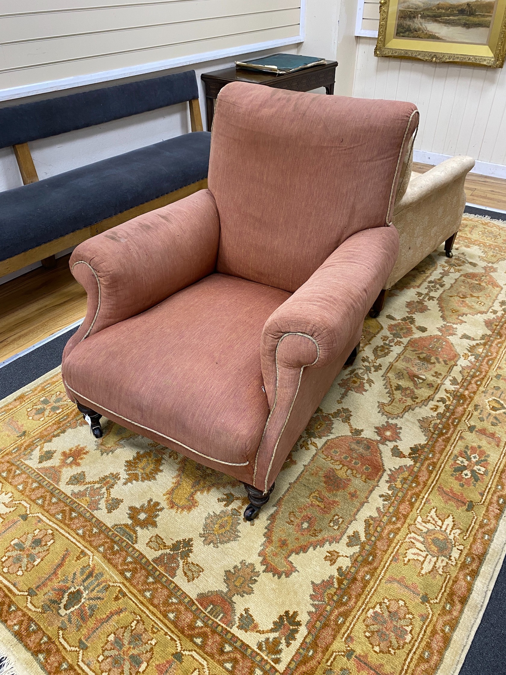 A Victorian mahogany armchair, upholstered faded red fabric, width 90cm, depth 102cm, height 96cm